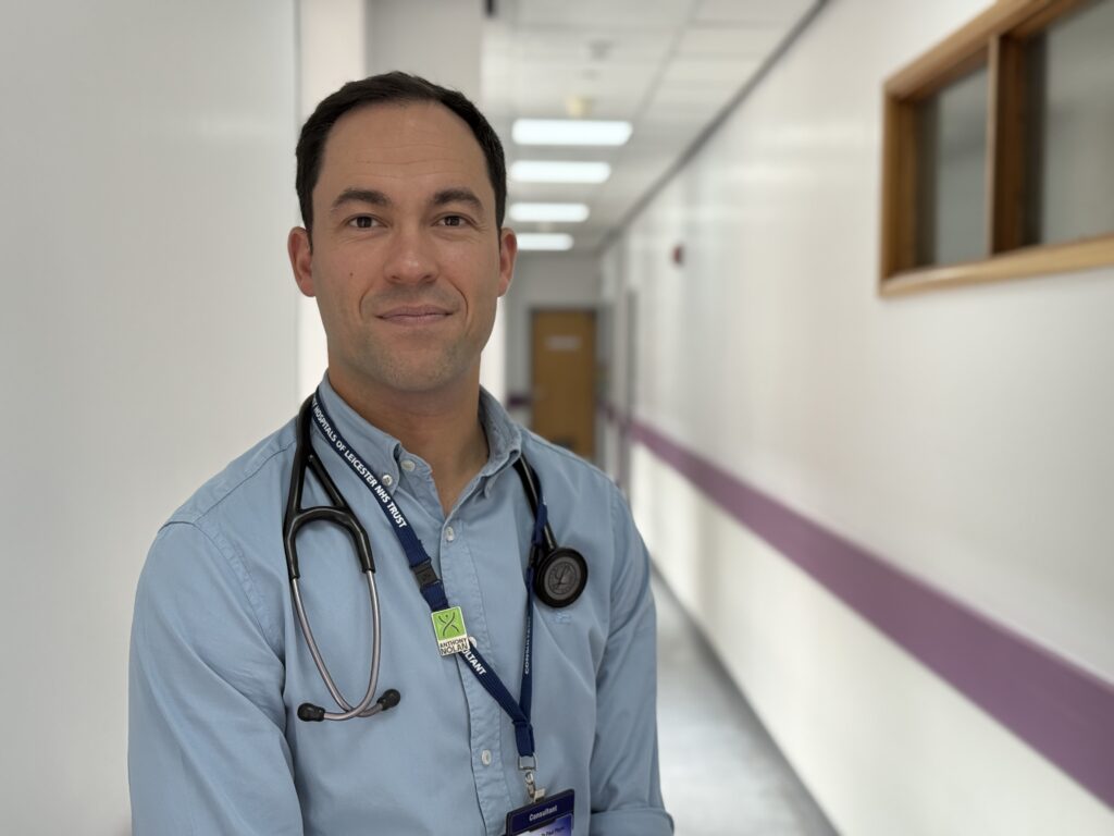Image of Paul Player, Consultant Haematologist at UHL standing in a corridor.