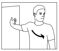 Man with arm stretched out touching a wall. 