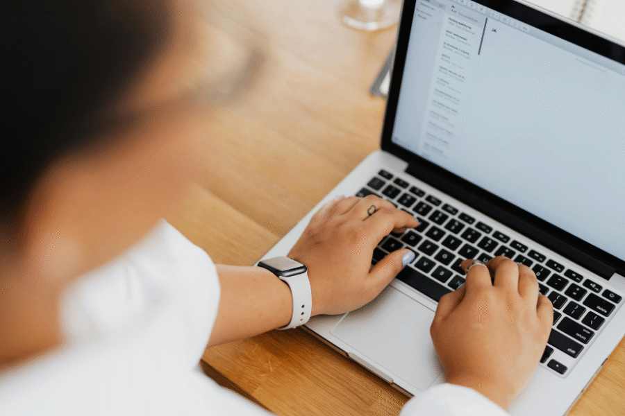 Woman typing on laptop